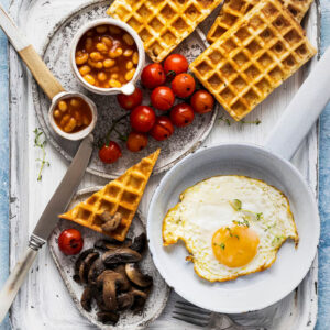 American Breakfast Combo - Waffles/Pancakes, Sausages, Bacon, eggs, Baked Beans, with tea or coffee.
