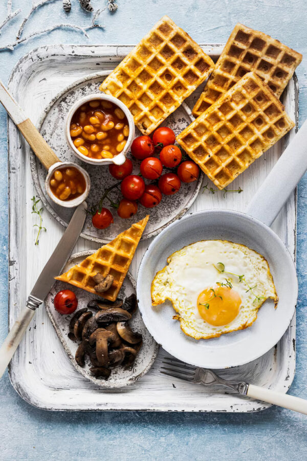 American Breakfast Combo - Waffles/Pancakes, Sausages, Bacon, eggs, Baked Beans, with tea or coffee.